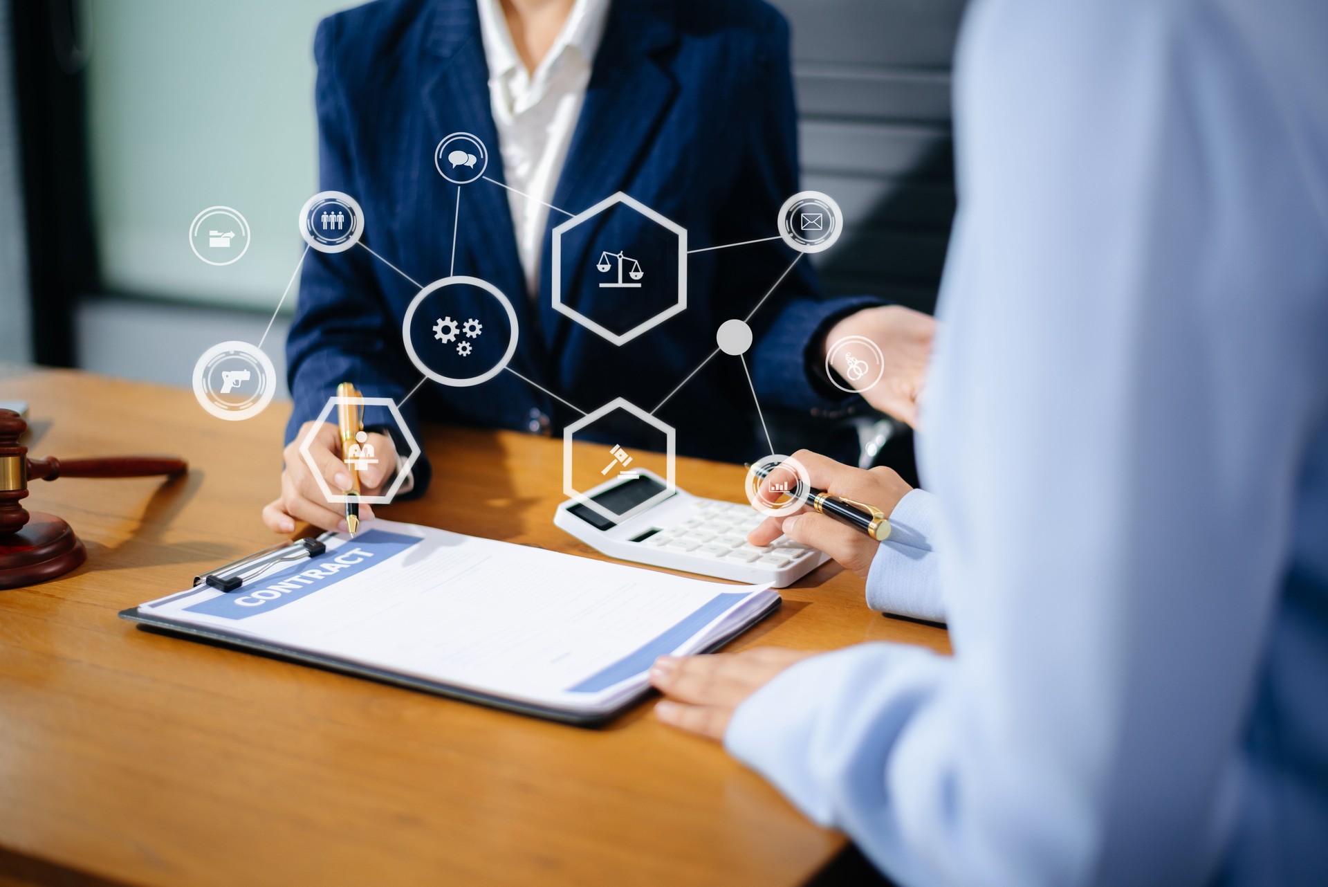 Business and lawyers discussing contract papers with brass scale on desk in office. Law, legal services, advice, justice and law concept